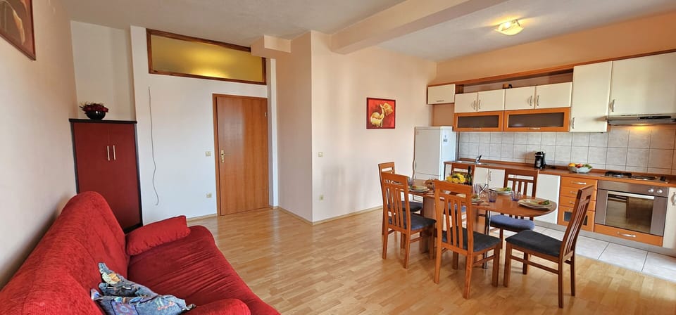 Open plan living/dining/kitchen area opening into sea view terrace