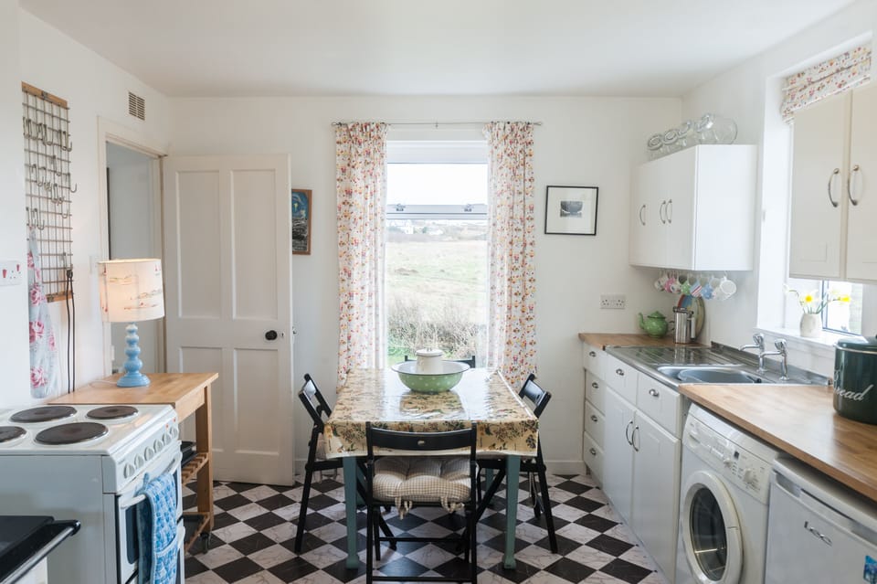 Kitchen with washing machine. Dryer in utility room. Freezer. And fabulous views