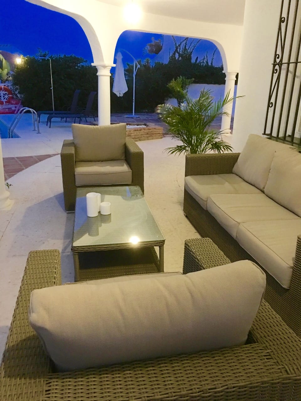 Relax in comfort, outside lounge and dining area overlooking pool, 