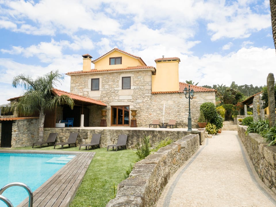 Back view of Maria's Home Left : Pool Area Right: Barbecue area & Swings