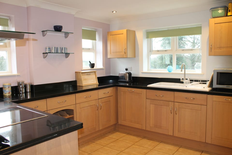 Kitchen with side window overlooking the next door paddock.
