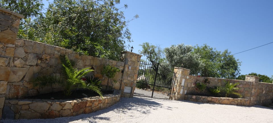 Villa Entrance & automated gates and 2m stone wall complete privacy & security..
