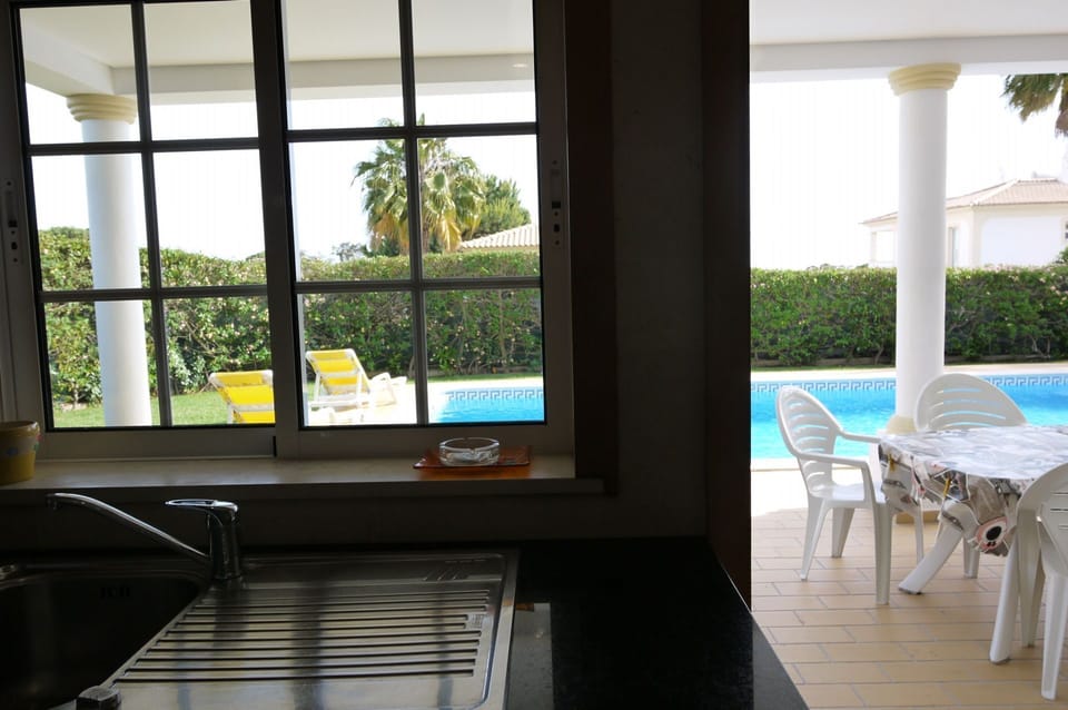 Enjoy Pool, Garden, Lawn and Sea Views from the kitchen, with own individual sound system.