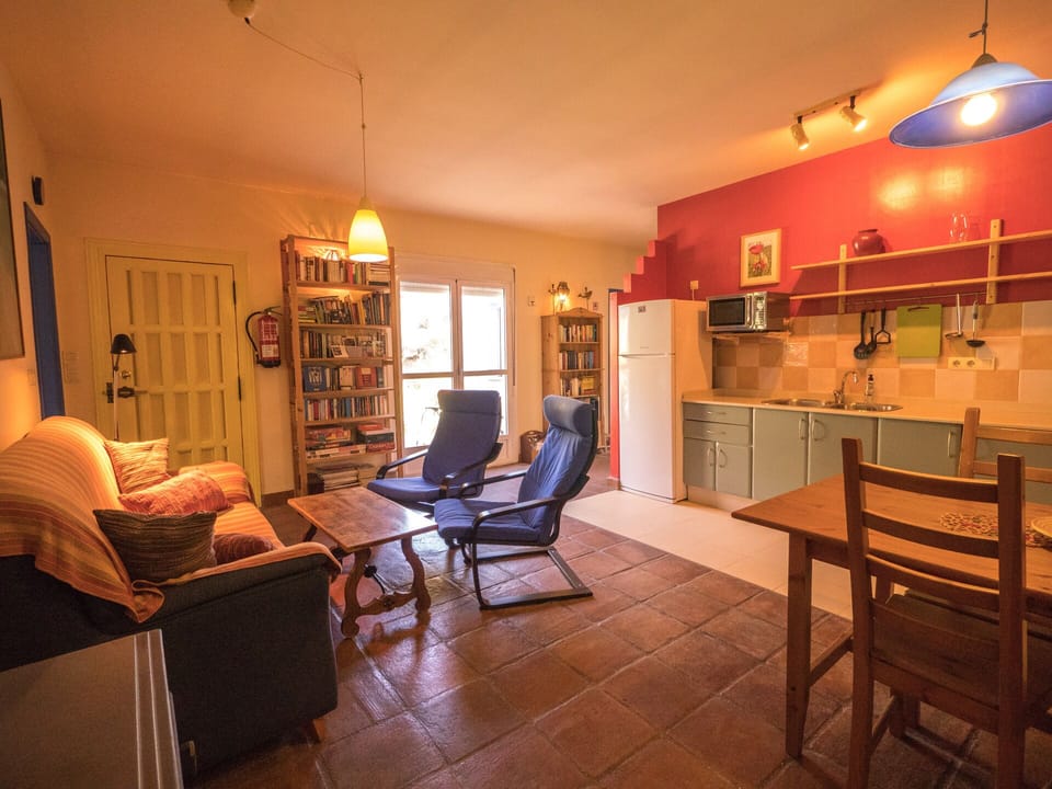 Open plan living space, with double doors to terrace