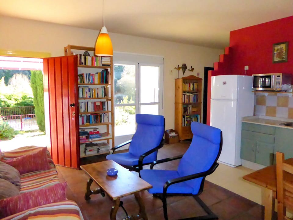 Comfortable living space with doors to terrace and pool