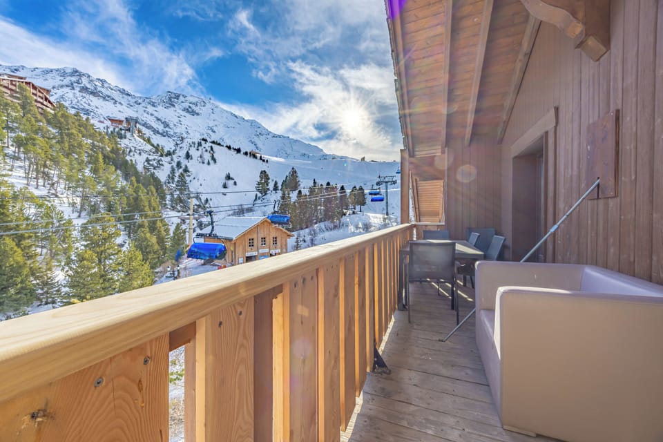 Balcony with views to Aiguille Rouge, and armchairs/table