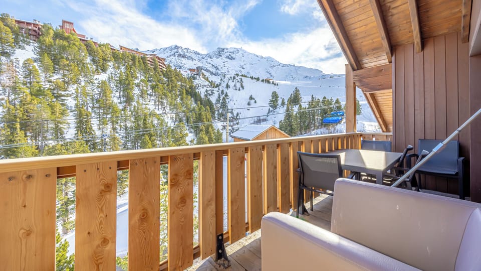 Balcony with views to Aiguille Rouge, and armchairs/table