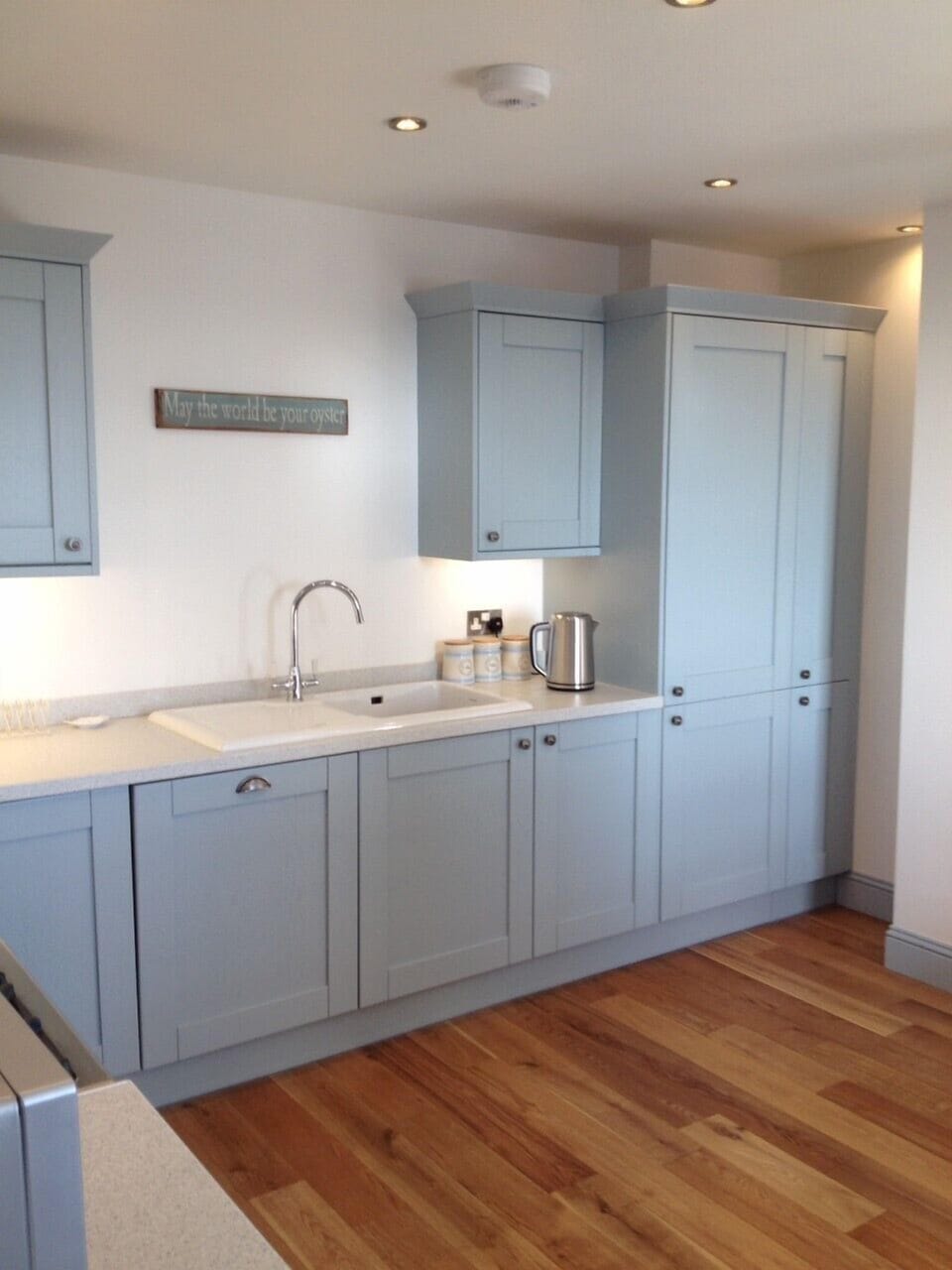 Modern well equipped seaside themed kitchen