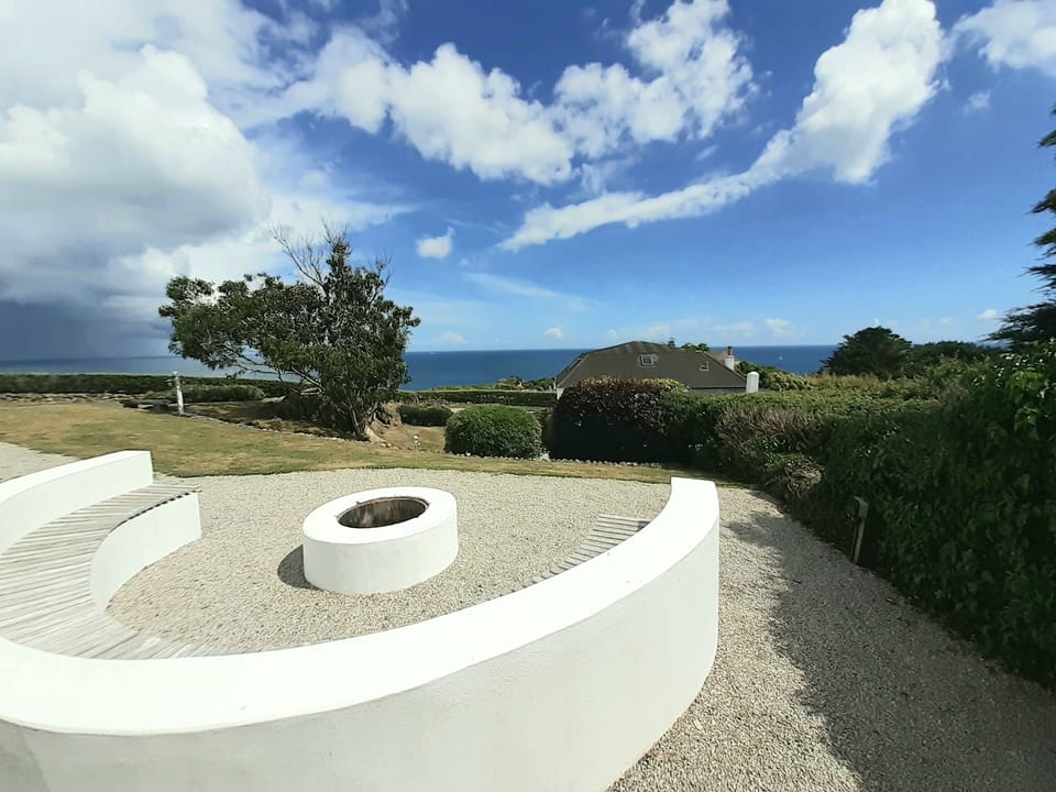 Toast marshmallows on the firepit in our garden with amazing seaviews seats 12