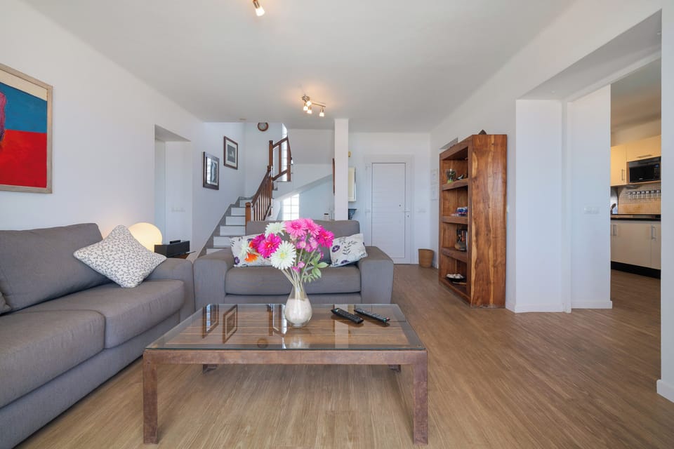 Living room and stairs to the upper floor