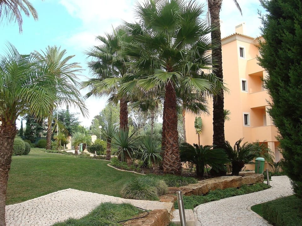 Walking through the garden to the apartment.