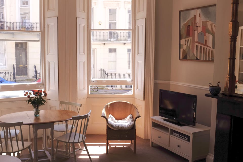 Sash windows with original wooden shutters