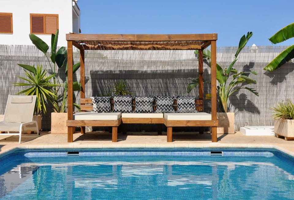 Soak up the sunshine from your very own  Balinese day bed.