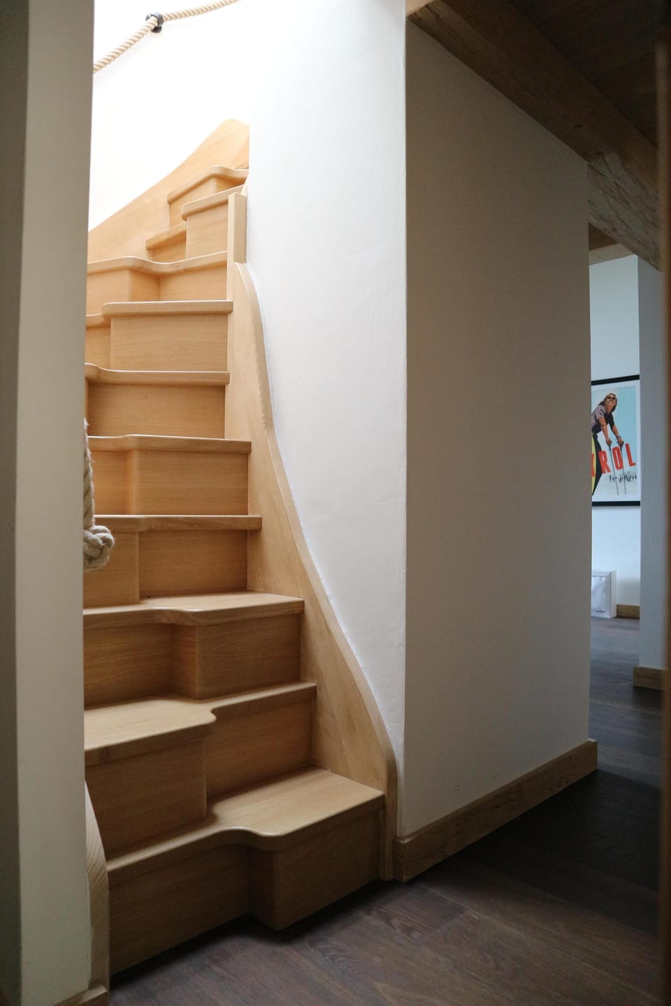 Bespoke wooden staircase connecting the upper and lower floors