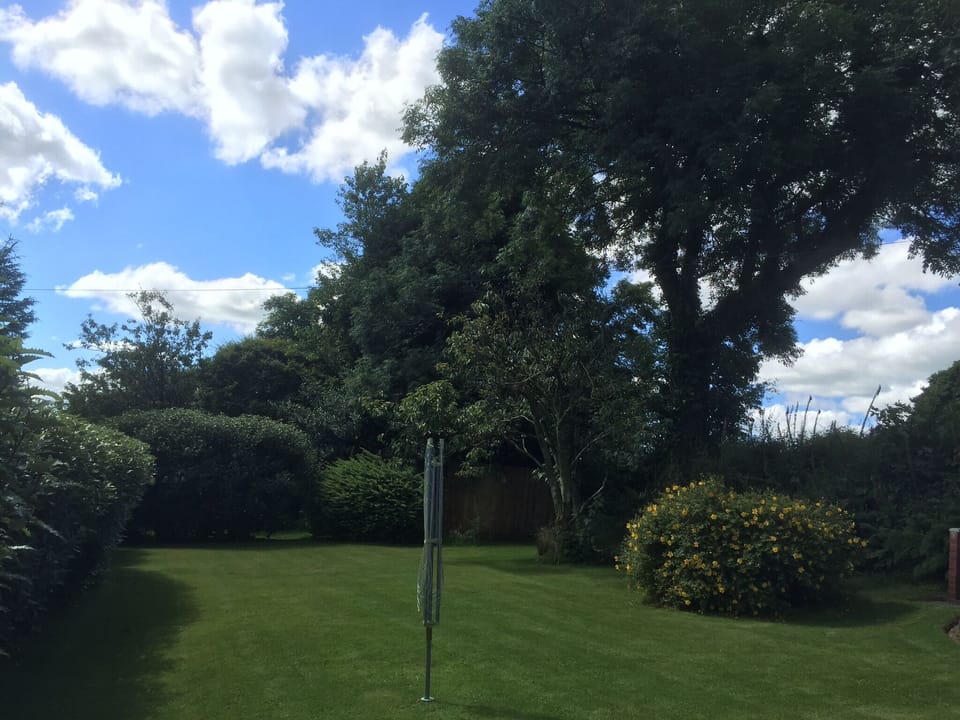 Private garden surrounded by open countryside