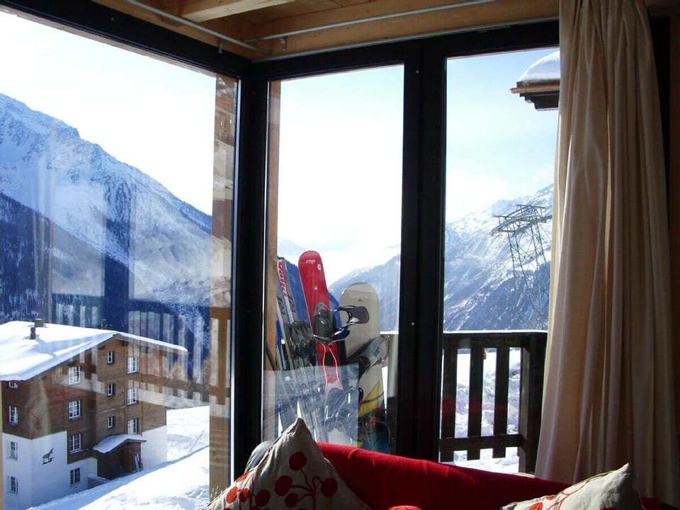 Looking out to the mountains the chalet has floor to ceiling glass windows