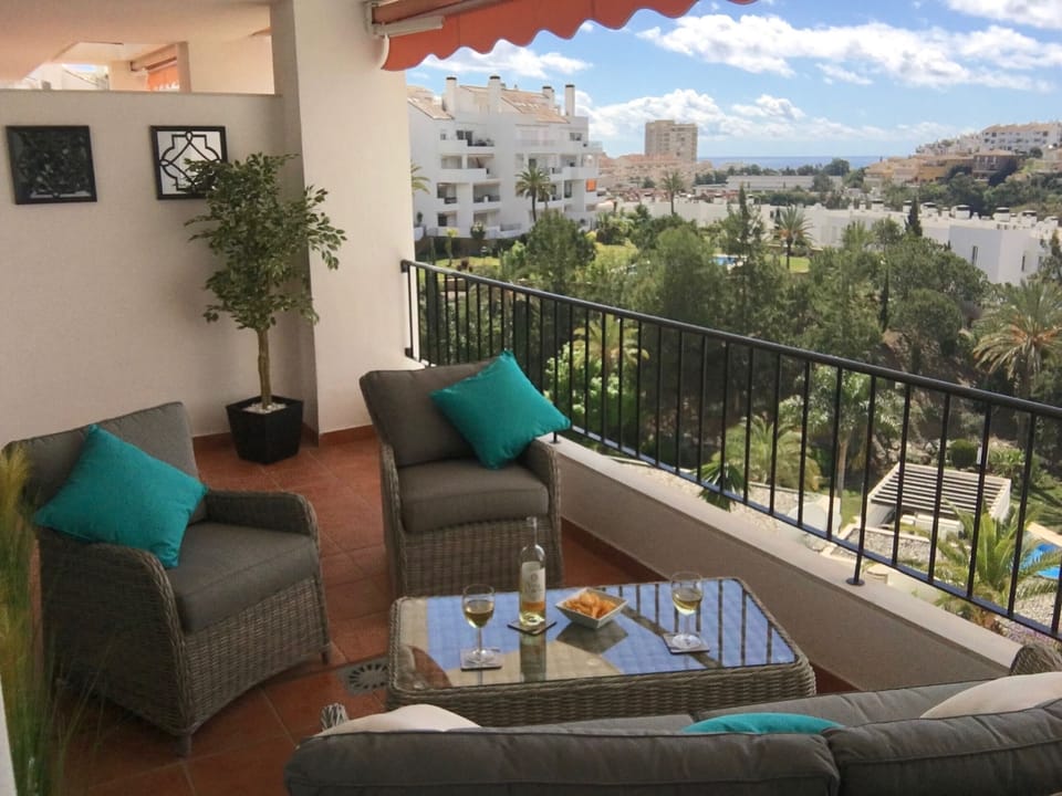 Spacious terrace over looking Torrequebrada golf course with sea & mountain view