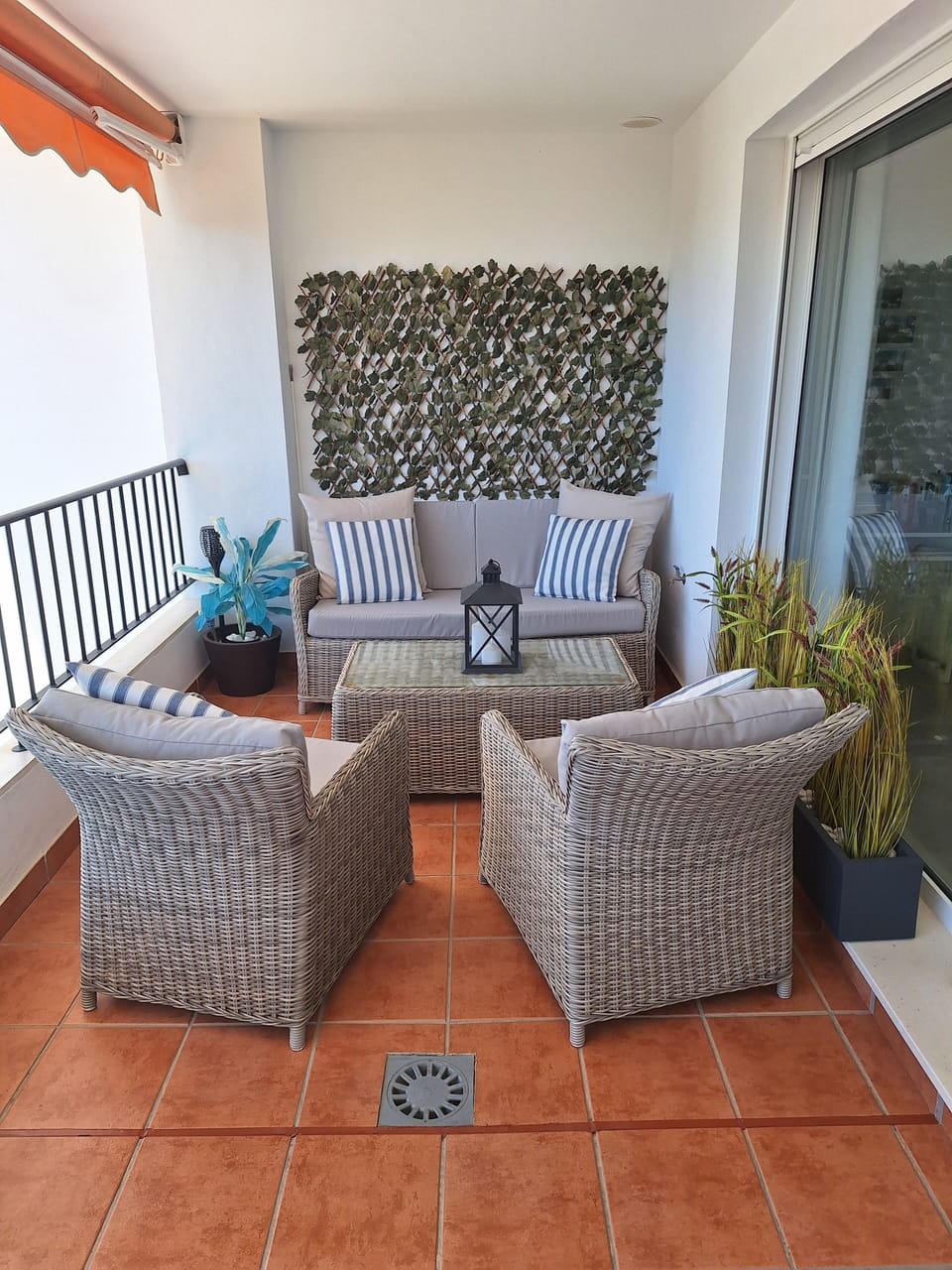 Main terrace with rattan furniture. 