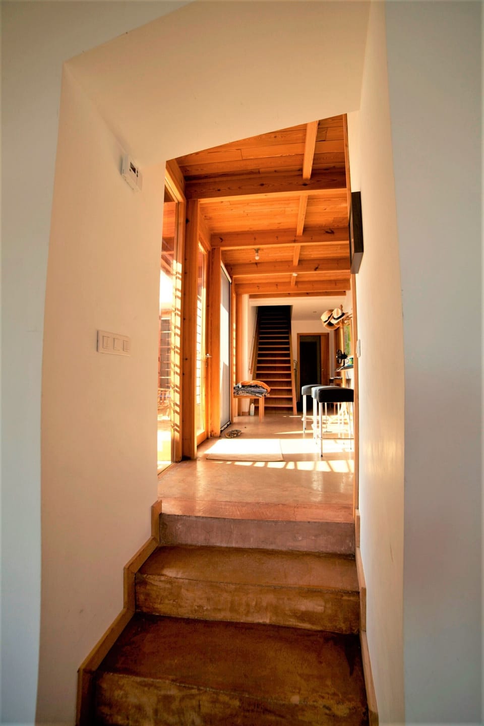 Steps from living room to kitchen