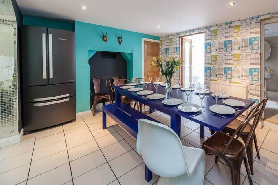 The dining room seats up to 18 people with patio at the back