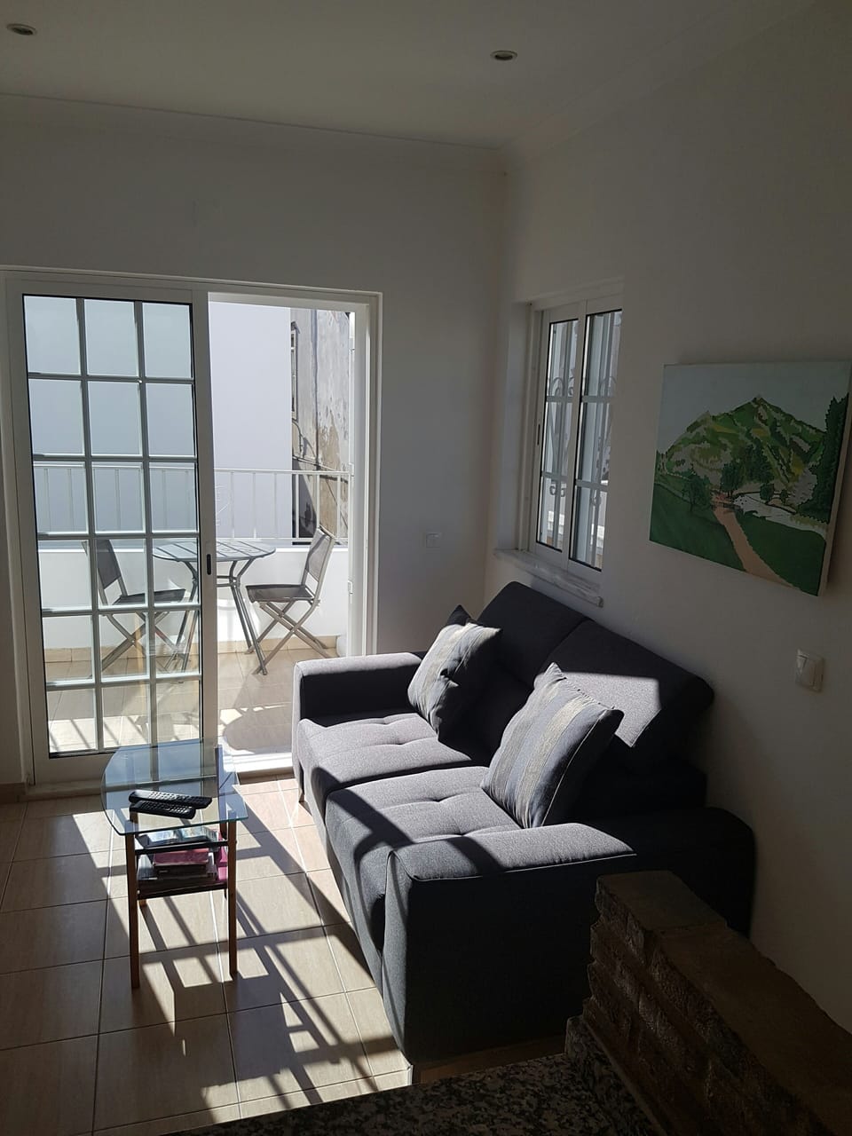 lounge area opening to lower terrace