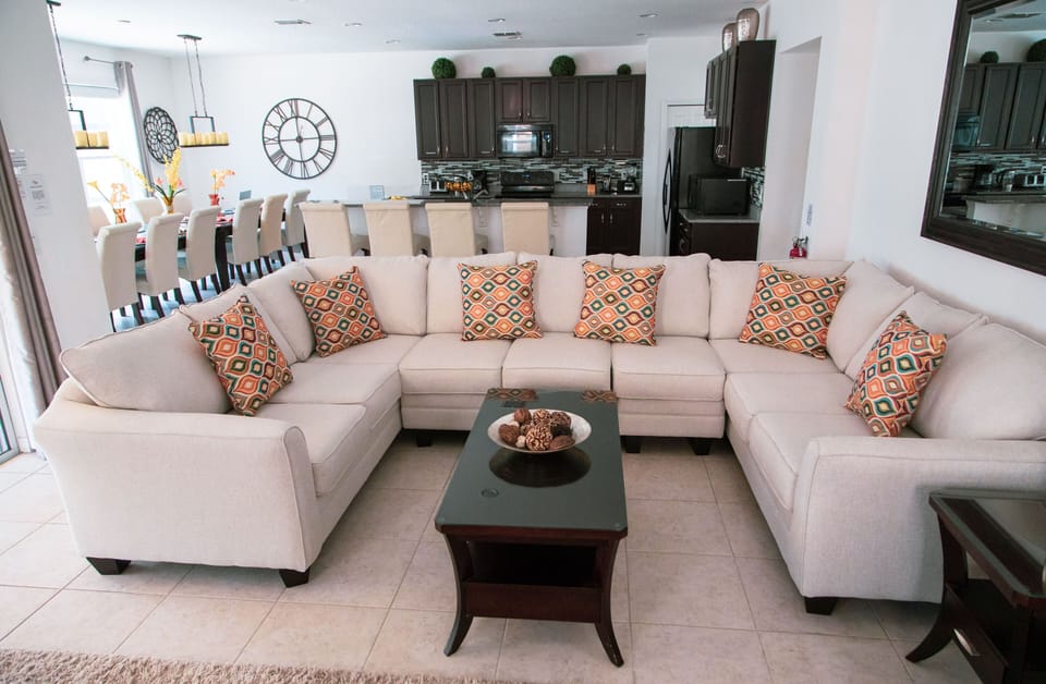Spacious open plan living showing kitchen, dining table and family living room 