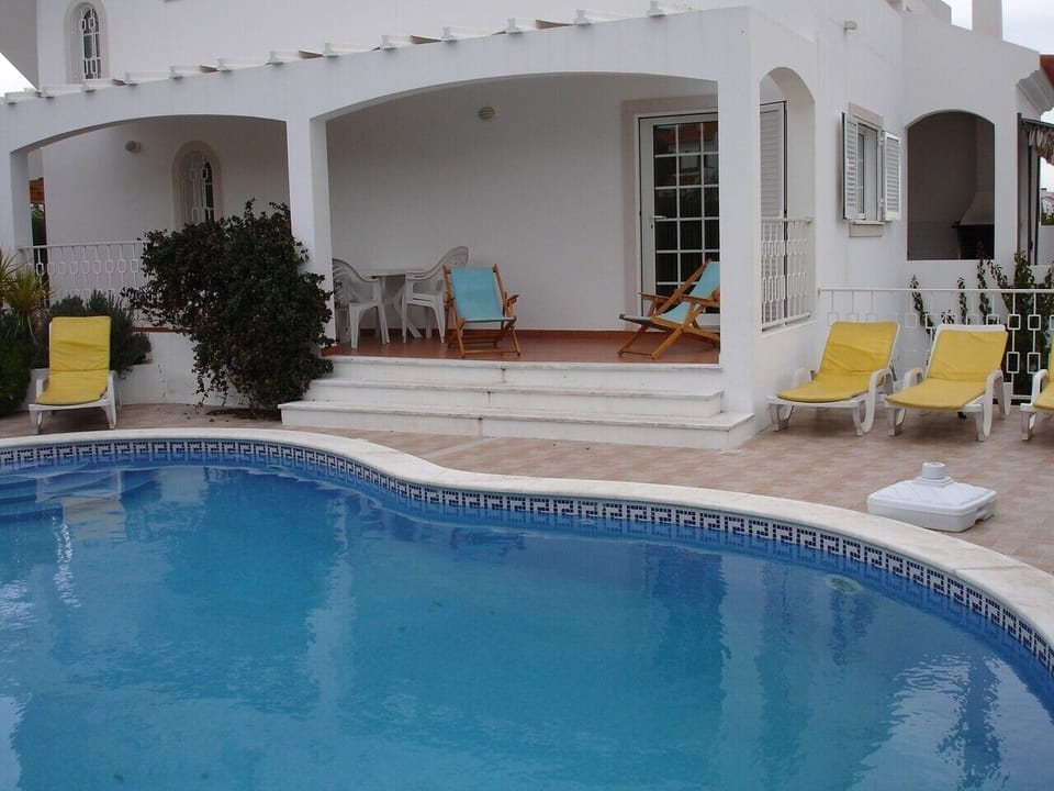 A rear view of the villa and pool