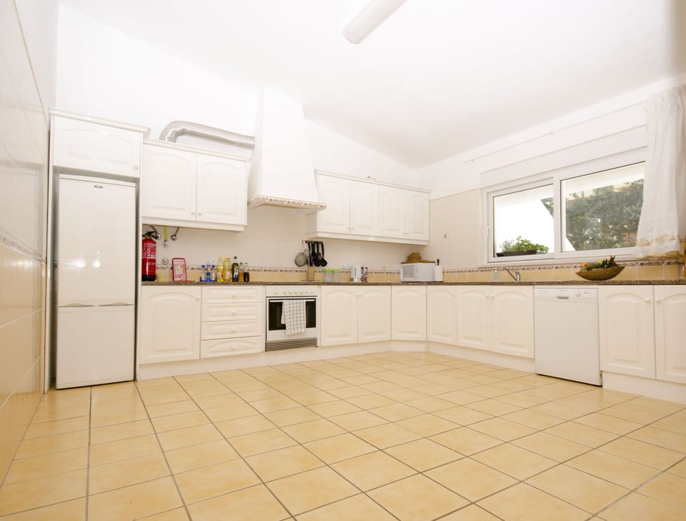 Fully equipped kitchen with fridge freezer, cooker, dishwasher and washer.