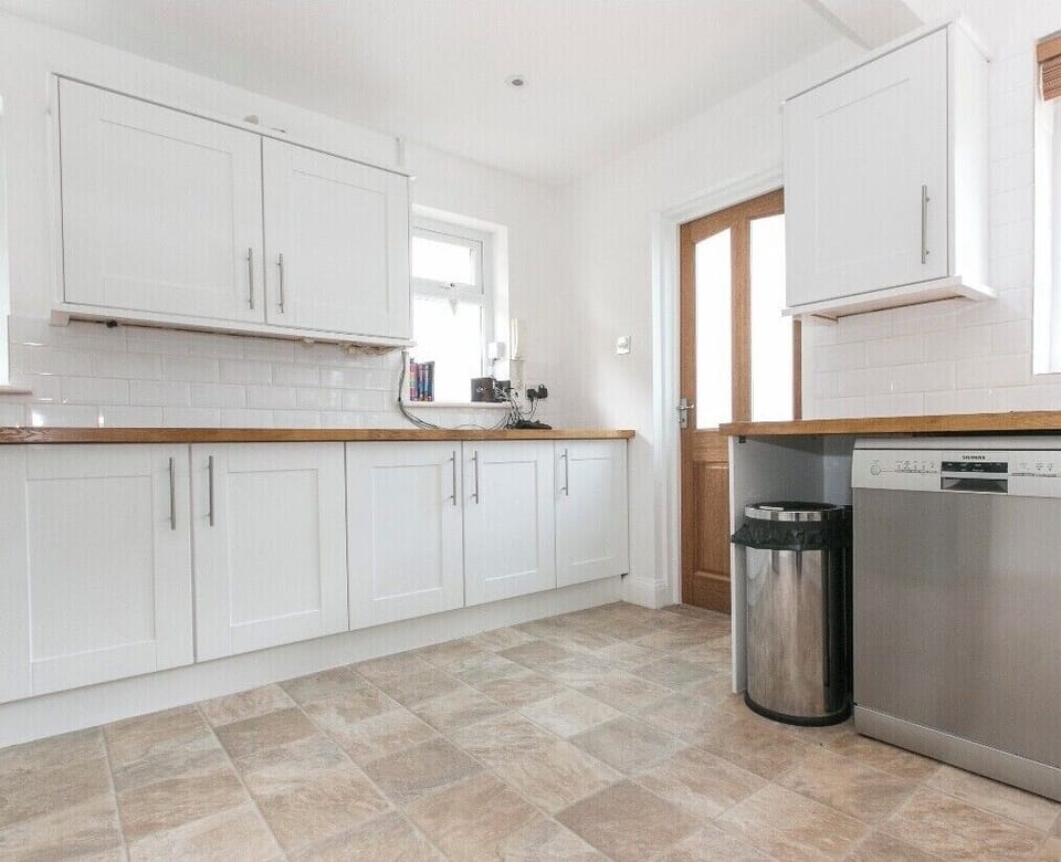 Kitchen with fridge freezer and also additional 4 drawer freezer, dishwasher etc