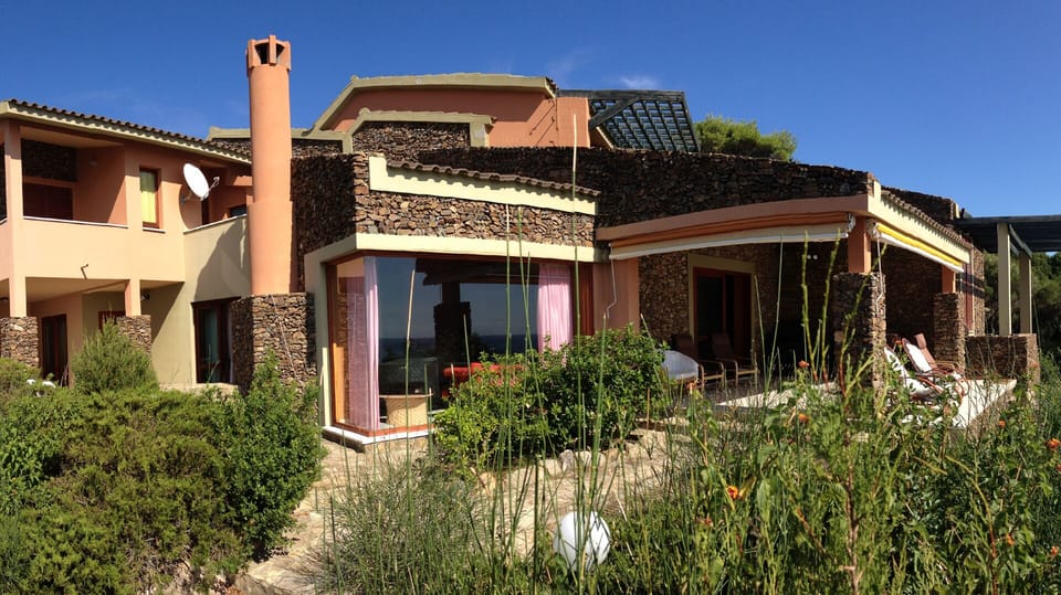Front view with some details: main terrace and living room panoramic window