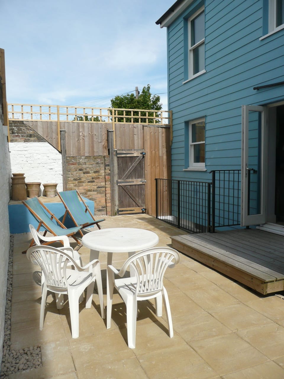 The (mostly) paved garden gets lovely morning sunshine....