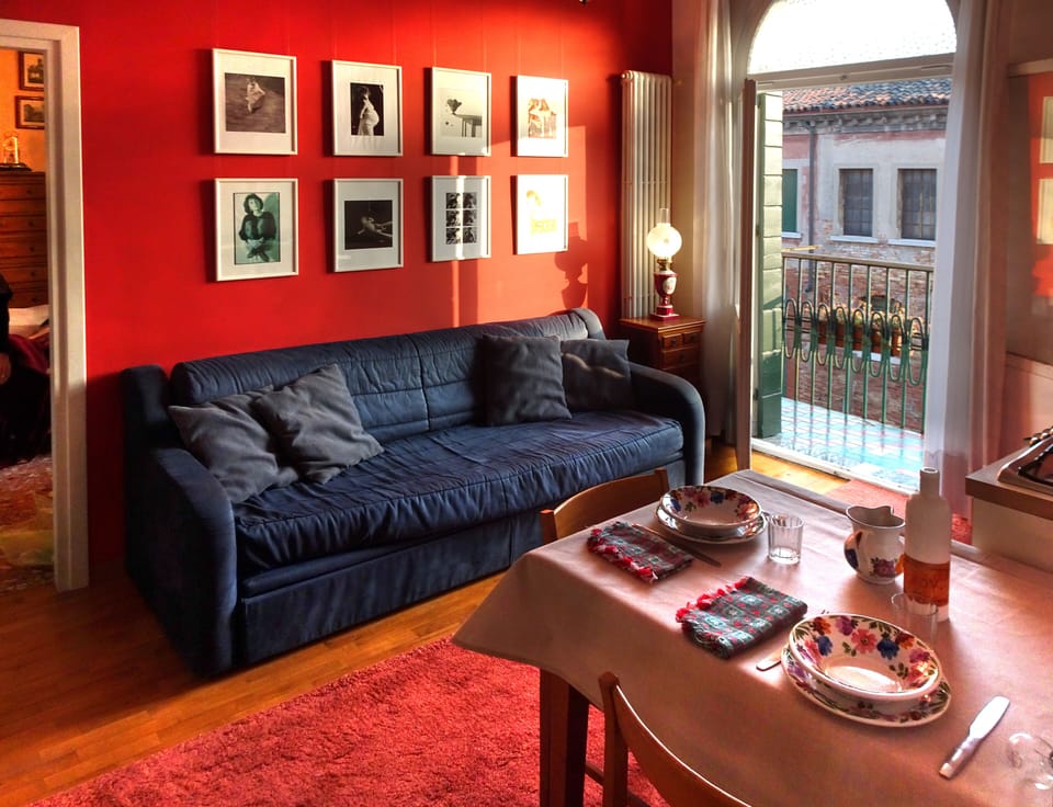 The living room with the blue sofa bed