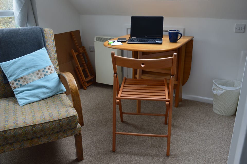 A drop-leaf table on the landing makes for a good workstation 
