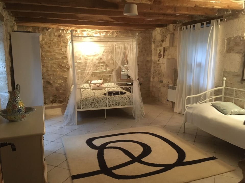 Downstairs bedroom in converted barn, double & full size day beds & wash basin
