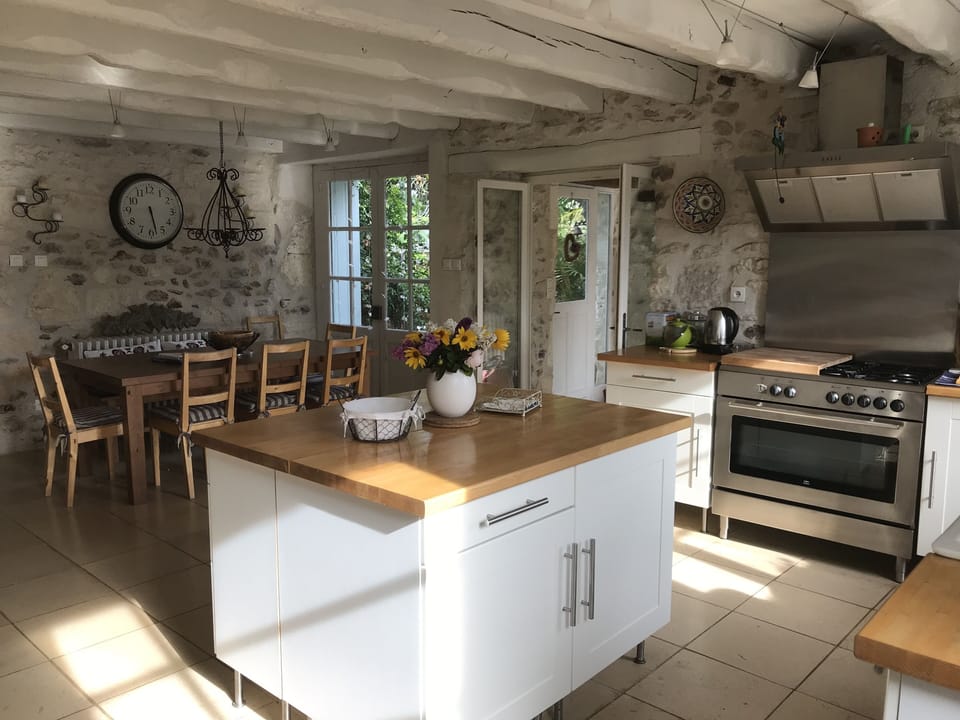 Large kitchen with all facilities, open plan with dining area.