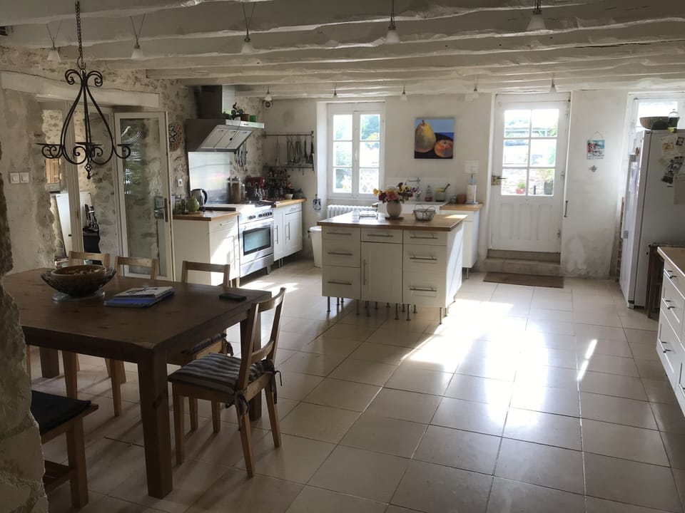 Large kitchen with all facilities and dining area, opens out onto patio.