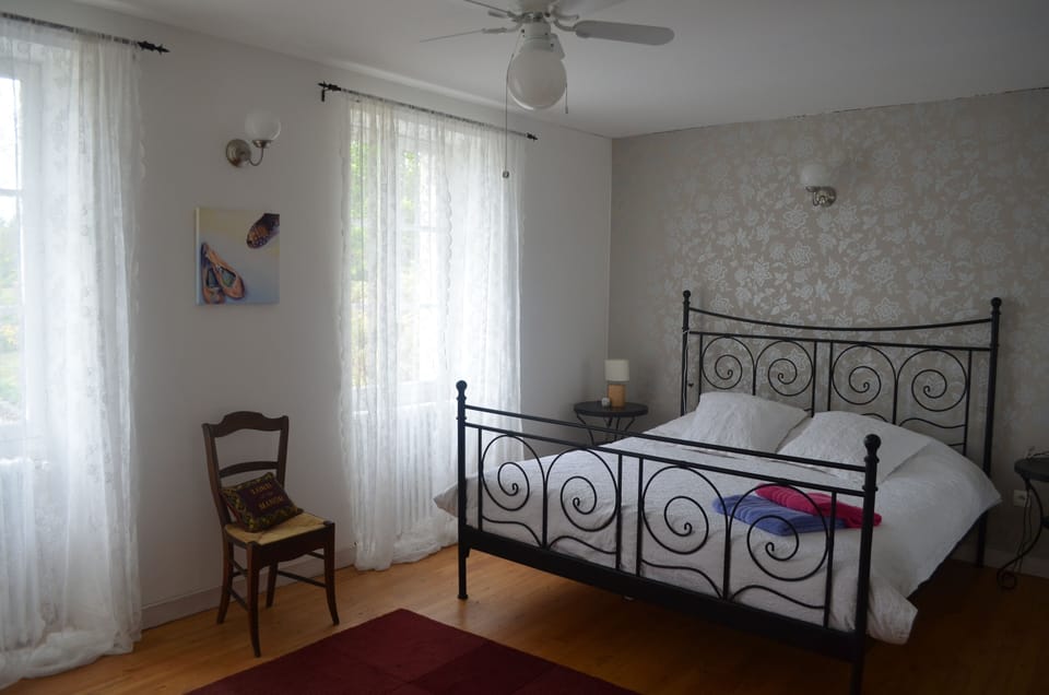 Double bedroom with ensuite and views over the pool and countryside.