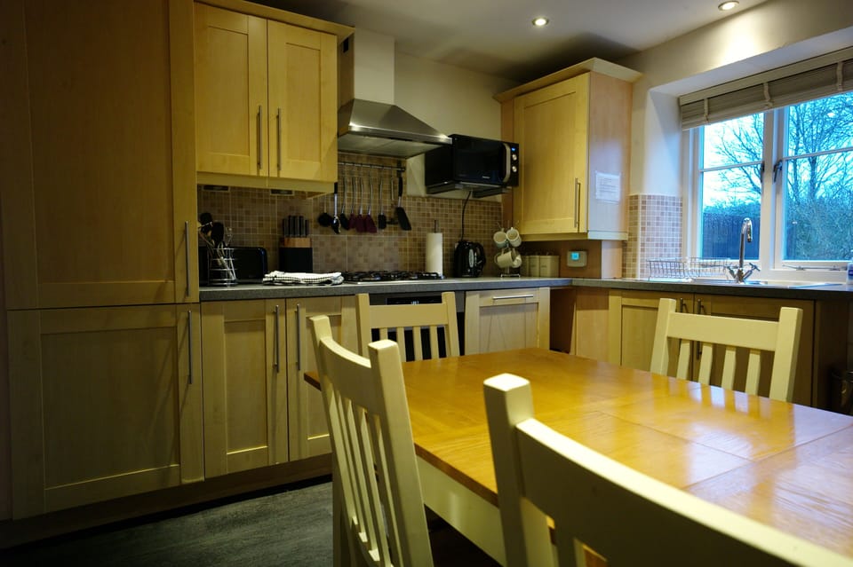 Modern kitchen with Miele oven and quality accessories.