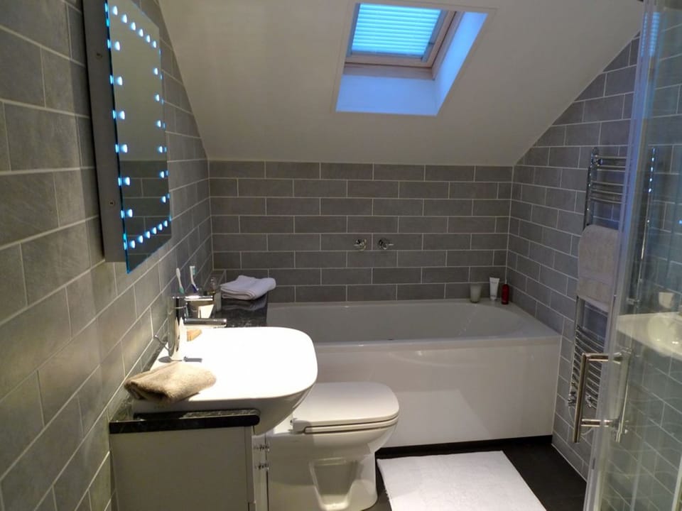 Bathroom with whirlpool bath and separate shower