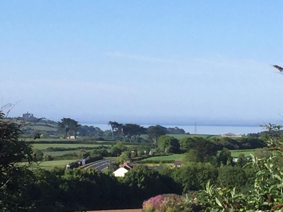 View on a sunny day from the master bedroom across to St Michaels Mount & the se