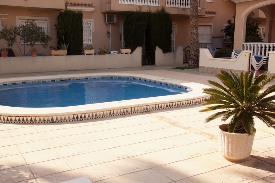 The view of the apartment from across the large, rarely busy, pool.