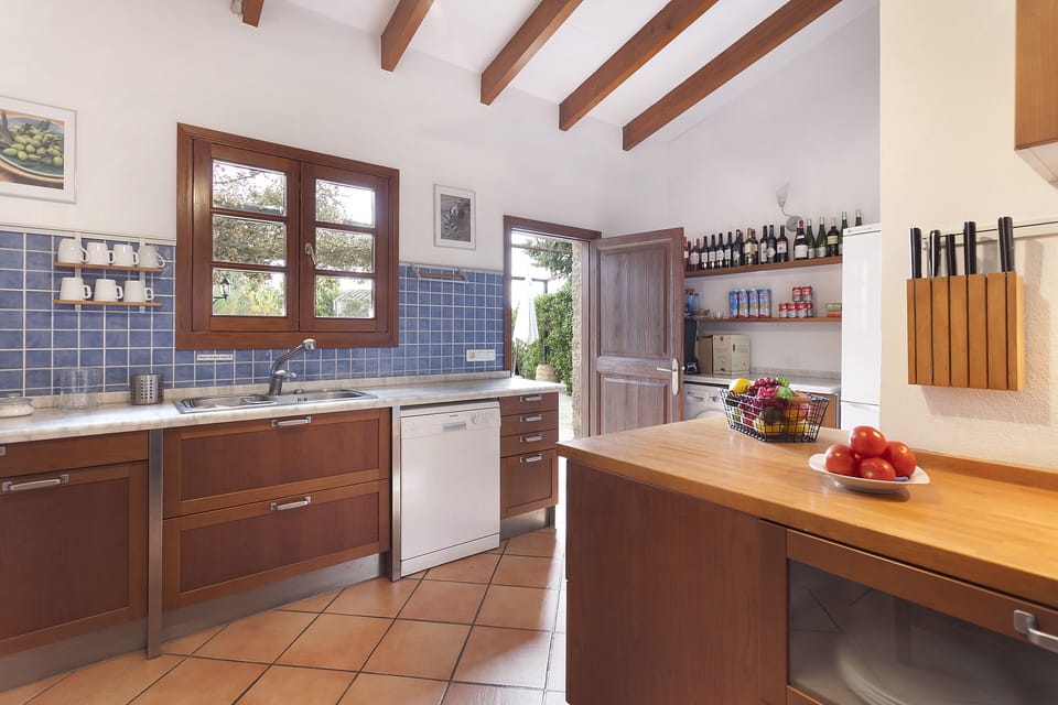Kitchen of main house, opens onto BBQ area