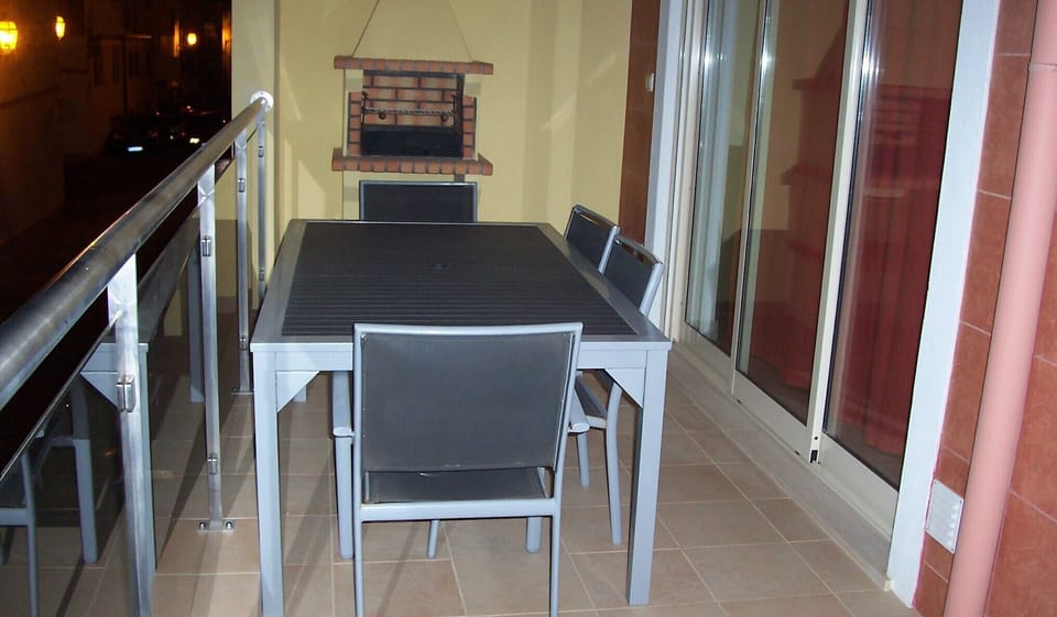 THE BALCONY WITH BUILT-IN BBQ