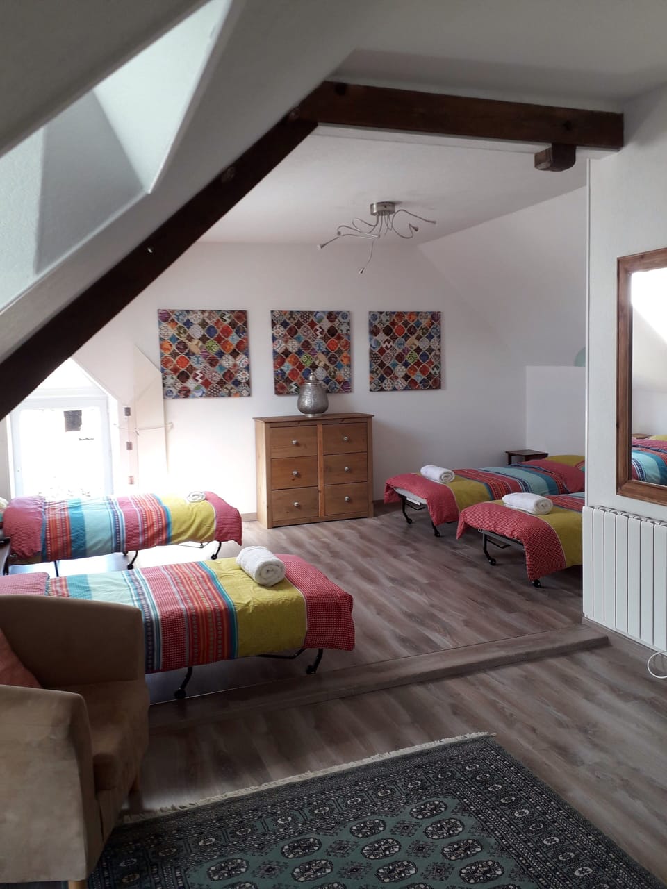 Second floor dormitory space with 4 single beds