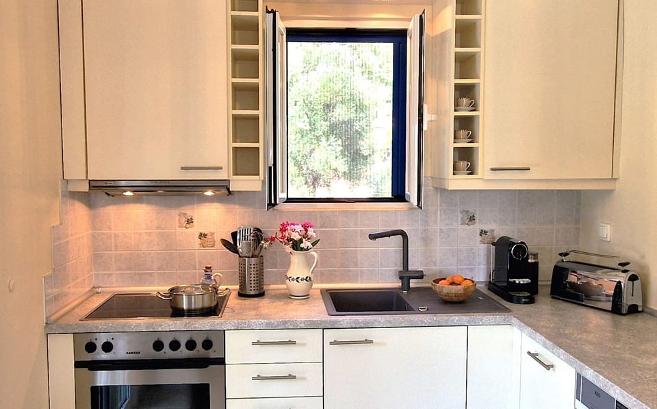 The open-plan kitchen, fully equipped for a keen cook.