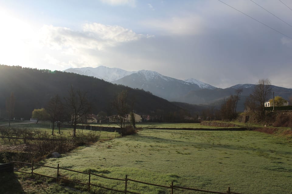 View of the meadow and mountain from the villa balcony