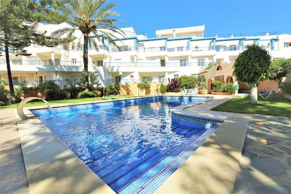 Inviting swimming pool available in the community surrounded by gardens