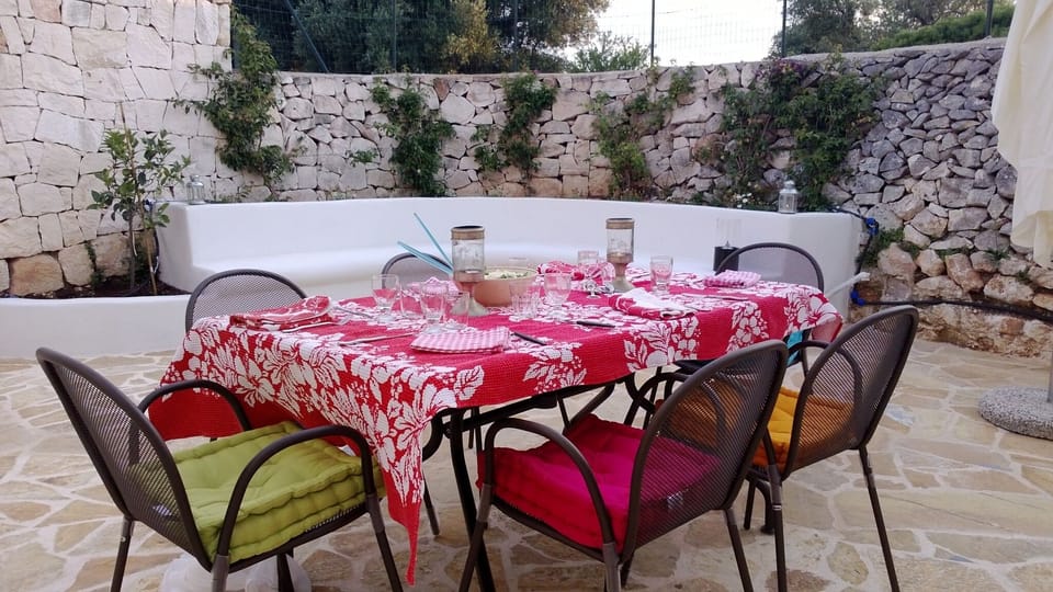 Dining in the courtyard.  there is a sail overhead 
 for the hottest days.