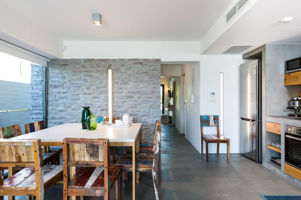 Indoor dining areas in both villas