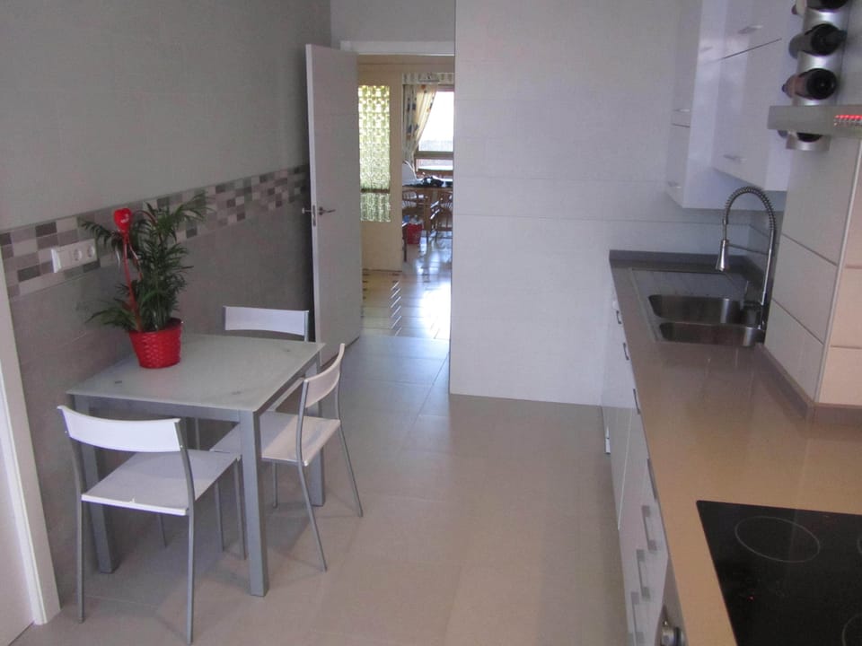 Very large kitchen with sea views, modern appliances,seating area & large larder